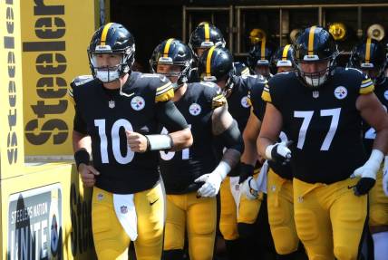 Aug 28, 2022; Pittsburgh, Pennsylvania, USA;  Pittsburgh Steelers quarterback Mitch Trubisky (10) leads the team out onto the field to warm up against the Detroit Lions at Acrisure Stadium. Mandatory Credit: Charles LeClaire-USA TODAY Sports