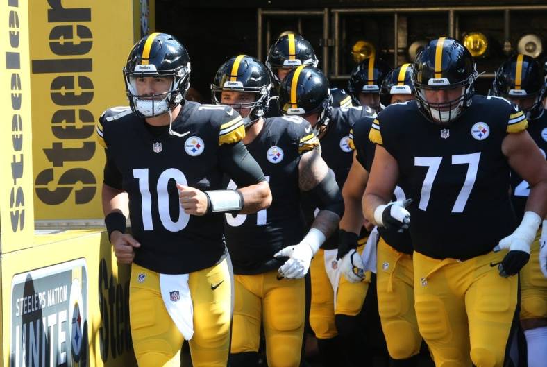 Aug 28, 2022; Pittsburgh, Pennsylvania, USA;  Pittsburgh Steelers quarterback Mitch Trubisky (10) leads the team out onto the field to warm up against the Detroit Lions at Acrisure Stadium. Mandatory Credit: Charles LeClaire-USA TODAY Sports