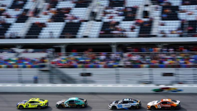 Aug 28, 2022; Daytona Beach, Florida, USA; NASCAR Cup Series driver Austin Cindric (2) and driver Austin Dillon (3) ,  driver Noah Gragson (62) and driver Tyler Reddick (8) race in the trioval during the Coke Zero Sugar 400 at Daytona International Speedway. Mandatory Credit: John David Mercer-USA TODAY Sports