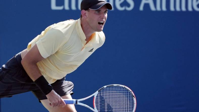 Aug 29, 2022; Flushing, NY, USA;  Dominic Thiem of Austria serves during his match against Pablo Carreno Busta of Spain on day one of the 2022 U.S. Open tennis tournament at USTA Billie Jean King National Tennis Center. Mandatory Credit: Jerry Lai-USA TODAY Sports