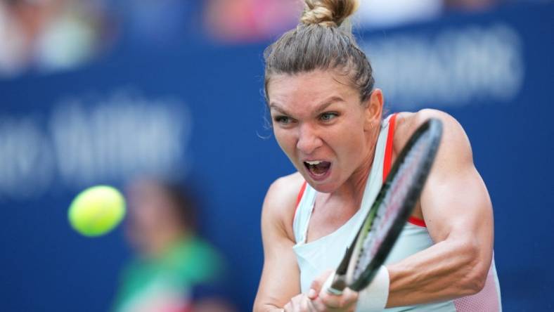 Aug 29, 2022; Flushing, NY, USA; Simona Halep of Romania hits to Daria Snigur of Ukraine on day one of the 2022 U.S. Open tennis tournament at USTA Billie Jean King National Tennis Center. Mandatory Credit: Danielle Parhizkaran-USA TODAY Sports