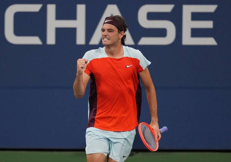 Aug 29, 2022; Flushing, NY, USA;  Taylor Fritz of the United States celebrates after winning a point against Brandon Holt of the United States on day one of the 2022 U.S. Open tennis tournament at USTA Billie Jean King National Tennis Center. Mandatory Credit: Jerry Lai-USA TODAY Sports