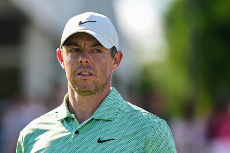 Aug 28, 2022; Atlanta, Georgia, USA; Rory McIlroy looks at the leaderboard on the 17th hole during the final round of the TOUR Championship golf tournament. Mandatory Credit: Adam Hagy-USA TODAY Sports