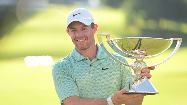 Aug 28, 2022; Atlanta, Georgia, USA; Rory McIlroy poses with the FedEx Trophy after winning the TOUR Championship golf tournament. Mandatory Credit: Adam Hagy-USA TODAY Sports