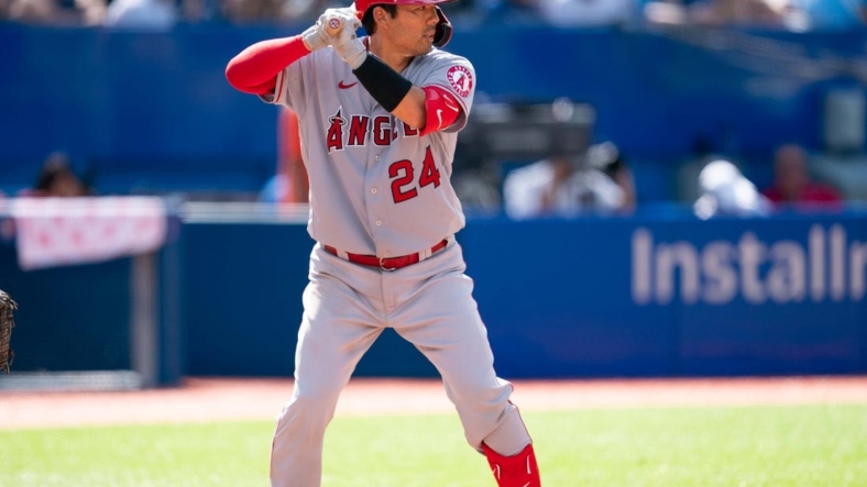 Aug 28, 2022; Toronto, Ontario, CAN; Los Angeles Angels catcher Kurt Suzuki (24) waits for a pitch against the Toronto Blue Jays during the seventh inning at Rogers Centre. Mandatory Credit: Nick Turchiaro-USA TODAY Sports