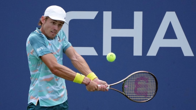 Aug 31, 2022; Flushing, NY, USA;  Alex de Minaur of Australia hits a shot against Cristian Garin of Chile on day three of the 2022 U.S. Open tennis tournament at USTA Billie Jean King Tennis Center. Mandatory Credit: Jerry Lai-USA TODAY Sports