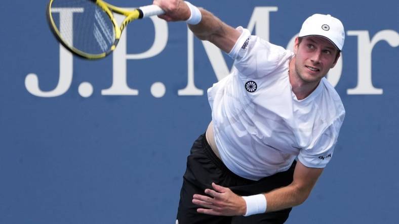 Aug 31, 2022; Flushing, NY, USA;  Botic van De Zandschulp of the Netherlands serves against Corentin Moutet of France on day three of the 2022 U.S. Open tennis tournament at USTA Billie Jean King Tennis Center. Mandatory Credit: Jerry Lai-USA TODAY Sports