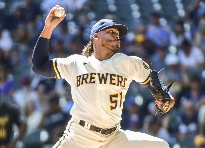 Aug 31, 2022; Milwaukee, Wisconsin, USA; Milwaukee Brewers pitcher Freddy Peralta (51) throws a pitch in the first inning against the Pittsburgh Pirates at American Family Field. Mandatory Credit: Benny Sieu-USA TODAY Sports