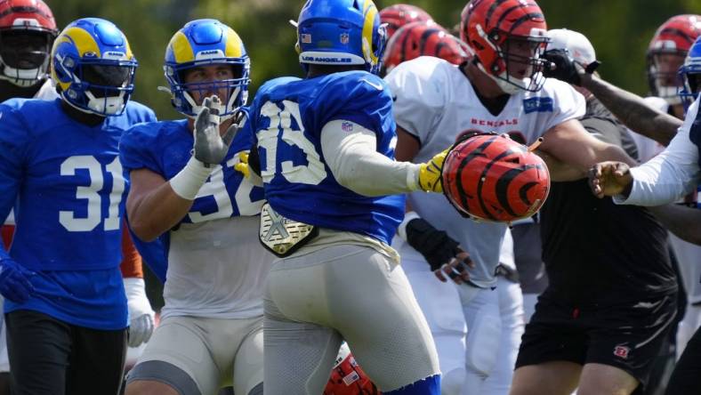 Rams defensive tackle Jonah Williams attempts to hold back Aaron Donald during a brawl during the joint practice against the Bengals.

Syndication The Enquirer