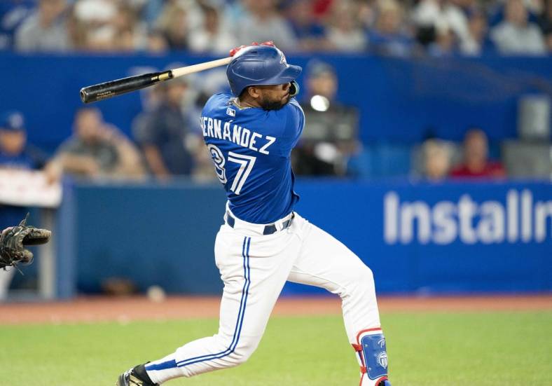 Aug 31, 2022; Toronto, Ontario, CAN; Toronto Blue Jays right fielder Teoscar Hernandez (37) hits a single against the Chicago Cubs during the fifth inning at Rogers Centre. Mandatory Credit: Nick Turchiaro-USA TODAY Sports
