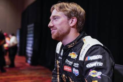 Sep 1, 2022; Charlotte, NC, USA; NASCAR Cup Series driver Tyler Reddick (8) talks with the media during the NASCAR Cup Series Playoff Media Day at Charlotte Convention Center. Mandatory Credit: Jim Dedmon-USA TODAY Sports
