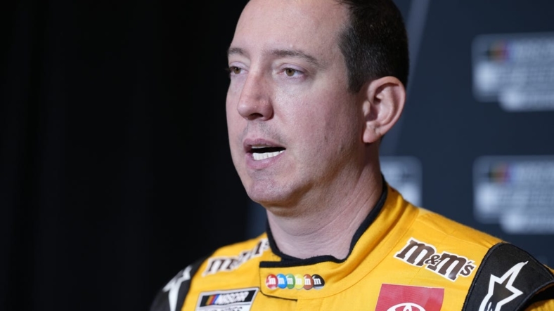 Sep 1, 2022; Charlotte, NC, USA; NASCAR Cup Series driver Kyle Busch (18) talks with the media during the NASCAR Cup Series Playoff Media Day at Charlotte Convention Center. Mandatory Credit: Jim Dedmon-USA TODAY Sports