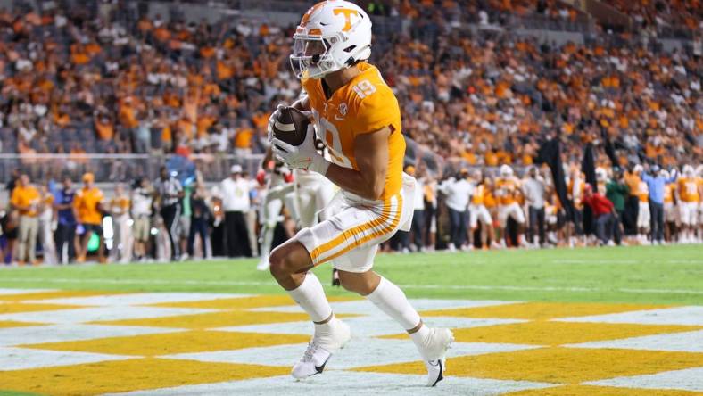 Sep 1, 2022; Knoxville, Tennessee, USA; Tennessee Volunteers wide receiver Walker Merrill (19) scores a touchdown against the Ball State Cardinals during the first half at Neyland Stadium. Mandatory Credit: Randy Sartin-USA TODAY Sports