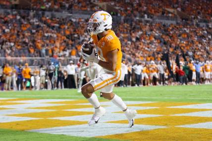 Sep 1, 2022; Knoxville, Tennessee, USA; Tennessee Volunteers wide receiver Walker Merrill (19) scores a touchdown against the Ball State Cardinals during the first half at Neyland Stadium. Mandatory Credit: Randy Sartin-USA TODAY Sports