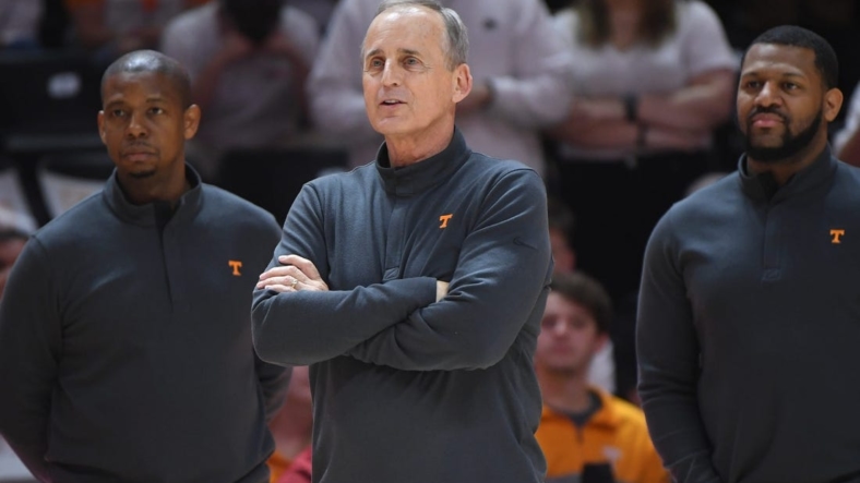 Tennessee head coach Rick Barnes listens as Tennessee forward John Fulkerson (10) speaks to the crowd during his senior day presentation before the final regular season game between Tennessee and Arkansas at Thompson-Boling Arena in Knoxville, Tenn., Saturday, March 5, 2022.Utark0305 0207