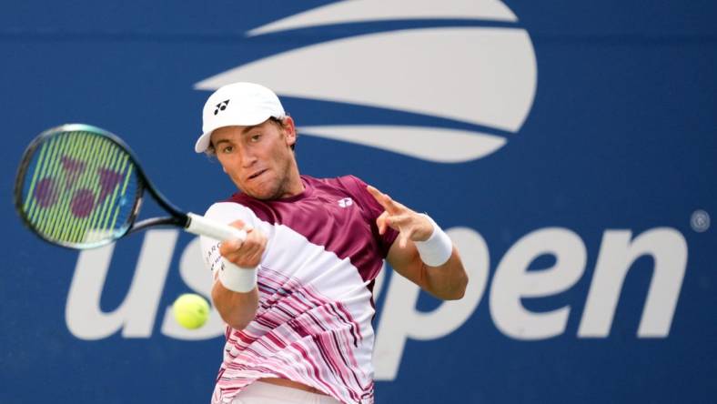 Sep 2, 2022; Flushing, NY, USA; Casper Ruud of Norway hits to Tommy Paul of the United States on day five of the 2022 U.S. Open tennis tournament at USTA Billie Jean King Tennis Center. Mandatory Credit: Danielle Parhizkaran-USA TODAY Sports