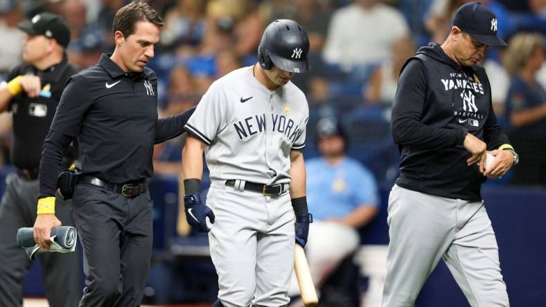 Sep 2, 2022; St. Petersburg, Florida, USA;  New York Yankees left fielder Andrew Benintendi (18) leaves the game during an at bat against the Tampa Bay Rays in the third inning at Tropicana Field. Mandatory Credit: Nathan Ray Seebeck-USA TODAY Sports