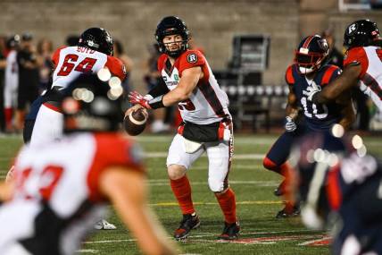 Sep 2, 2022; Montreal, Quebec, CAN; Ottawa Redblacks quarterback Nick Arbuckle (19) gets ready to pass the ball during the second quarter at Percival Molson Memorial Stadium. Mandatory Credit: David Kirouac-USA TODAY Sports