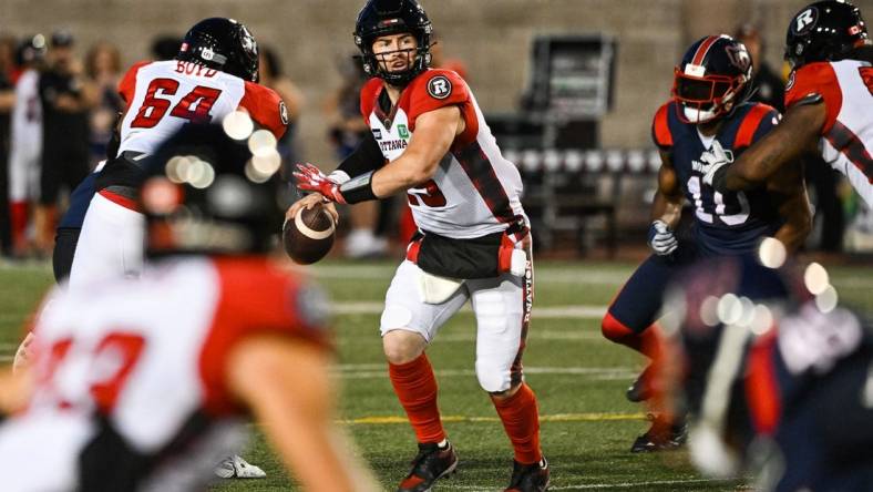 Sep 2, 2022; Montreal, Quebec, CAN; Ottawa Redblacks quarterback Nick Arbuckle (19) gets ready to pass the ball during the second quarter at Percival Molson Memorial Stadium. Mandatory Credit: David Kirouac-USA TODAY Sports