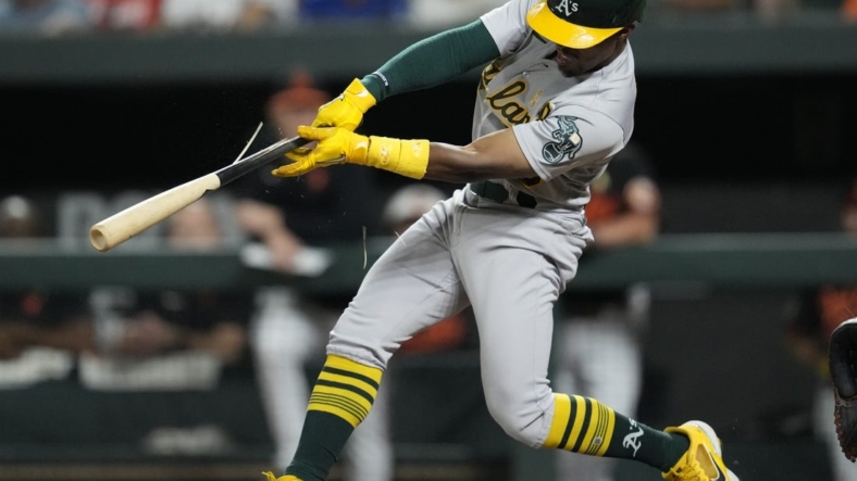 Sep 2, 2022; Baltimore, Maryland, USA; Oakland Athletics left fielder Tony Kemp (5) breaks his bat while hitting a two run RBI single against the Baltimore Orioles during the fifth inning  at Oriole Park at Camden Yards. Mandatory Credit: Brent Skeen-USA TODAY Sports