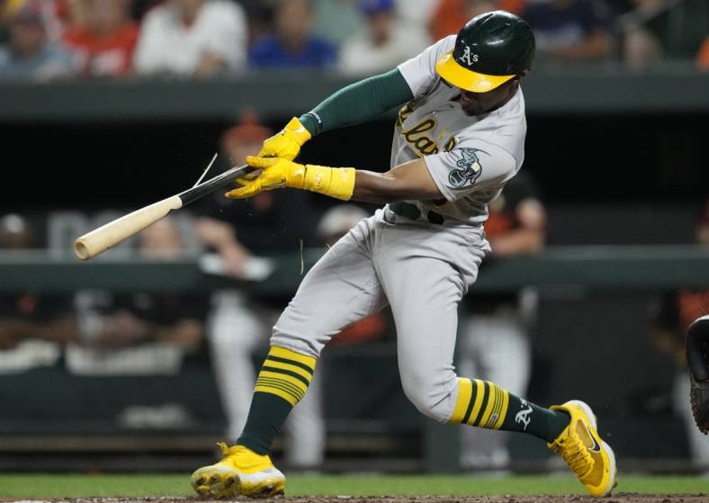 Sep 2, 2022; Baltimore, Maryland, USA; Oakland Athletics left fielder Tony Kemp (5) breaks his bat while hitting a two run RBI single against the Baltimore Orioles during the fifth inning  at Oriole Park at Camden Yards. Mandatory Credit: Brent Skeen-USA TODAY Sports