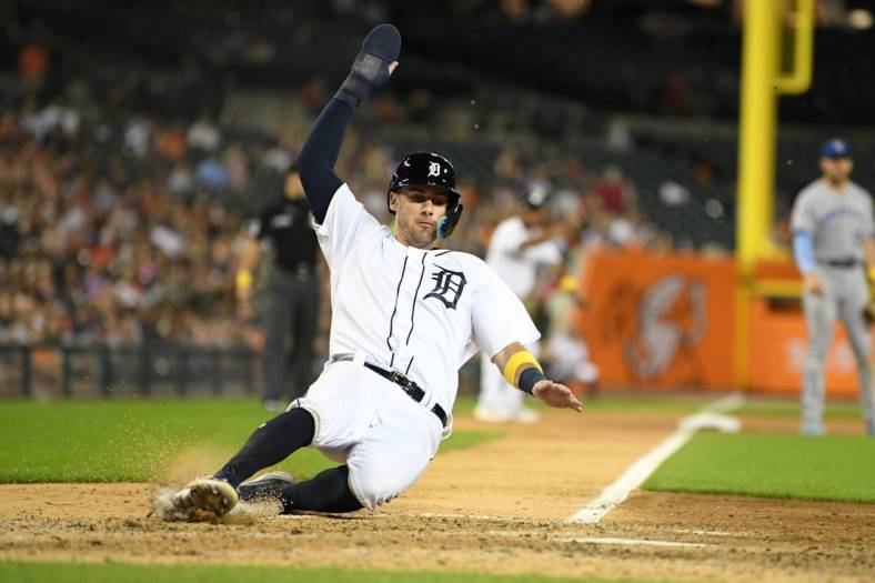 Sep 2, 2022; Detroit, Michigan, USA; Detroit Tigers third baseman Ryan Kreidler (32) slides safely into home on a sacrifice fly by right fielder Victor Reyes (22) (not pictured) against the Kansas City Royals in the fifth inning at Comerica Park. Mandatory Credit: Lon Horwedel-USA TODAY Sports