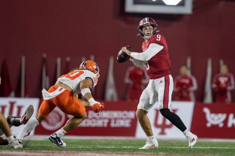 Sep 2, 2022; Bloomington, Indiana, USA; Indiana Hoosiers quarterback Connor Bazelak (9) drops back to pass the ball while Illinois Fighting Illini defensive back Sydney Brown (30) defends in the first quarter at Memorial Stadium. Mandatory Credit: Trevor Ruszkowski-USA TODAY Sports