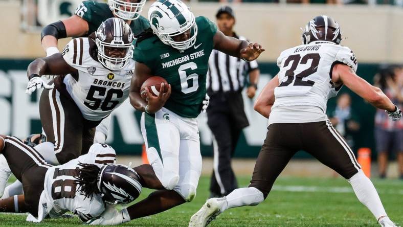 Michigan State tight end Maliq Carr (6) runs against Western Michigan cornerback Keni-H Lovely (18) during the first half at Spartan Stadium in East Lansing on Friday, Sept. 2, 2022.