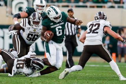 Michigan State tight end Maliq Carr (6) runs against Western Michigan cornerback Keni-H Lovely (18) during the first half at Spartan Stadium in East Lansing on Friday, Sept. 2, 2022.