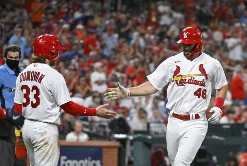 Sep 2, 2022; St. Louis, Missouri, USA;  St. Louis Cardinals first baseman Paul Goldschmidt (46) and designated hitter Brendan Donovan (33) celebrate after they both scored against the Chicago Cubs during the first inning at Busch Stadium. Mandatory Credit: Jeff Curry-USA TODAY Sports