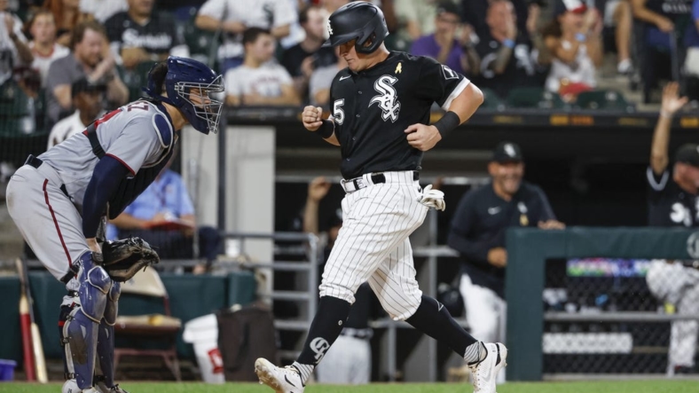 Sep 2, 2022; Chicago, Illinois, USA; Chicago White Sox left fielder Andrew Vaughn (25) scores against the Minnesota Twins during the fourth inning at Guaranteed Rate Field. Mandatory Credit: Kamil Krzaczynski-USA TODAY Sports
