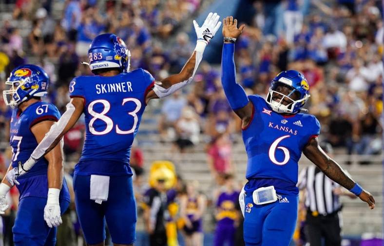 Sep 2, 2022; Lawrence, Kansas, USA; Kansas Jayhawks quarterback Jalon Daniels (6) celebrates with wide receiver Quentin Skinner (83) after scoring a touchdown against the Tennessee Tech Golden Eagles during the first half at David Booth Kansas Memorial Stadium. Mandatory Credit: Jay Biggerstaff-USA TODAY Sports