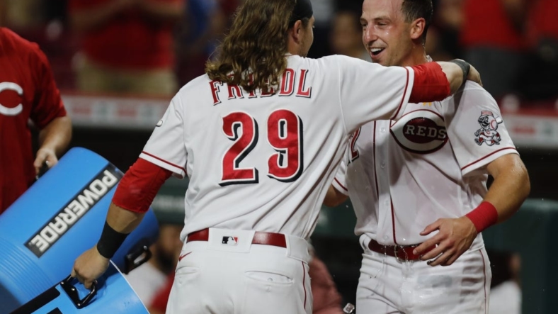 Sep 2, 2022; Cincinnati, Ohio, USA; Sep 2, 2022; Cincinnati, Ohio, USA; Cincinnati Reds third baseman Spencer Steer (right) reacts with outfielder TJ Friedl (29) after Steer scored the winning run against the Colorado Rockies at Great American Ball Park. Mandatory Credit: David Kohl-USA TODAY Sports