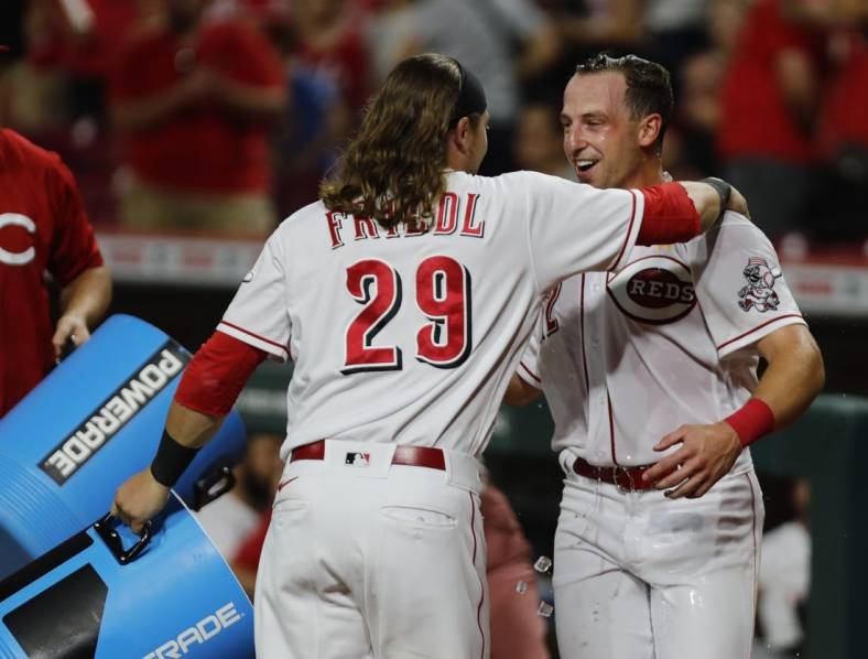 Sep 2, 2022; Cincinnati, Ohio, USA; Sep 2, 2022; Cincinnati, Ohio, USA; Cincinnati Reds third baseman Spencer Steer (right) reacts with outfielder TJ Friedl (29) after Steer scored the winning run against the Colorado Rockies at Great American Ball Park. Mandatory Credit: David Kohl-USA TODAY Sports