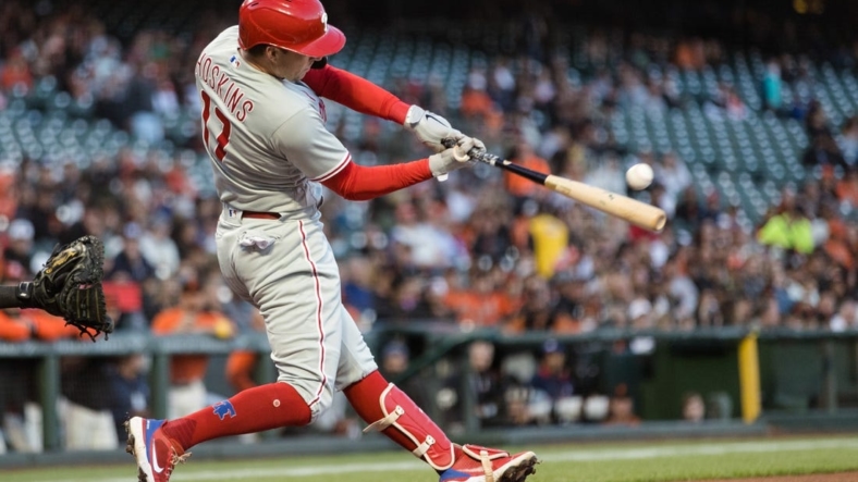 Sep 2, 2022; San Francisco, California, USA; Philadelphia Phillies first baseman Rhys Hoskins (17) hits a single against the San Francisco Giants during the first inning at Oracle Park. Mandatory Credit: John Hefti-USA TODAY Sports