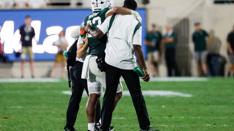 Michigan State linebacker Darius Snow (23) is carried off the field during the first half against Western Michigan at Spartan Stadium in East Lansing on Friday, Sept. 2, 2022.