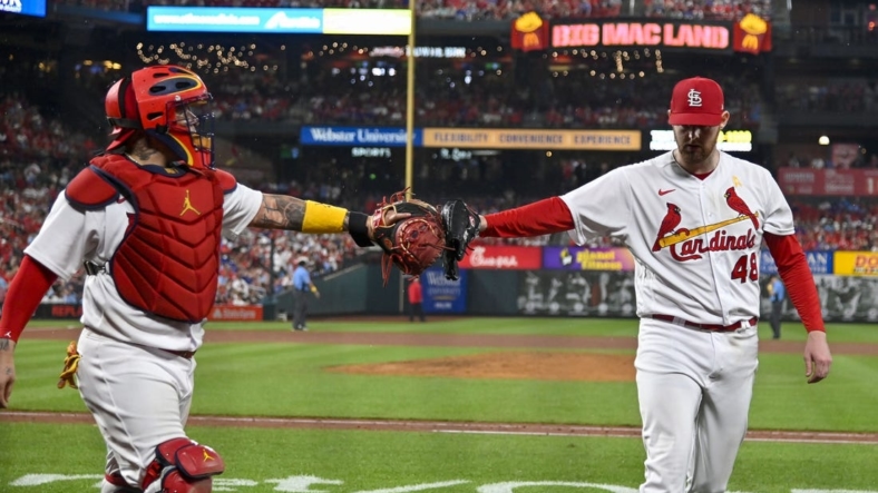 Sep 2, 2022; St. Louis, Missouri, USA;  St. Louis Cardinals catcher Yadier Molina (4) celebrates with starting pitcher Jordan Montgomery (48) after the sixth inning against the Chicago Cubs at Busch Stadium. Mandatory Credit: Jeff Curry-USA TODAY Sports