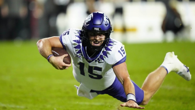 Sep 2, 2022; Boulder, Colorado, USA; TCU Horned Frogs quarterback Max Duggan (15) dives with the ball in the fourth quarter against the Colorado Buffaloes at Folsom Field. Mandatory Credit: Ron Chenoy-USA TODAY Sports