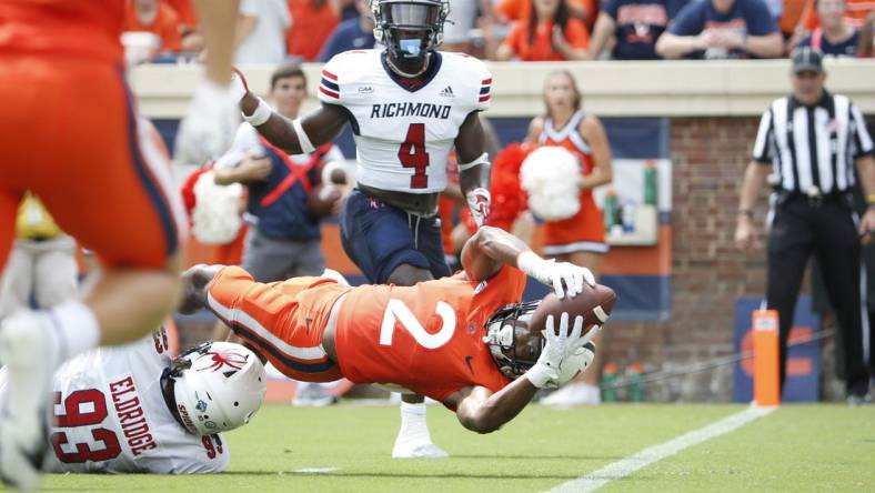 Sep 3, 2022; Charlottesville, Virginia, USA; Virginia Cavaliers running back Perris Jones (2) scores a touchdown in front of Richmond Spiders defensive lineman Ray Eldridge (93) during the first half at Scott Stadium. Mandatory Credit: Amber Searls-USA TODAY Sports