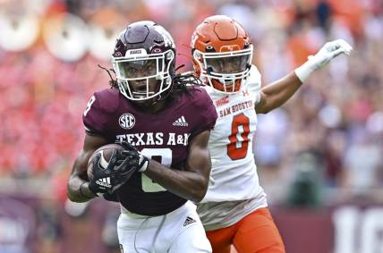 Sep 3, 2022; College Station, Texas, USA;  Texas A&M Aggies wide receiver Yulkeith Brown (8) catches the pass for a touchdown during the first quarter against the Sam Houston State Bearkats at Kyle Field. Mandatory Credit: Maria Lysaker-USA TODAY Sports