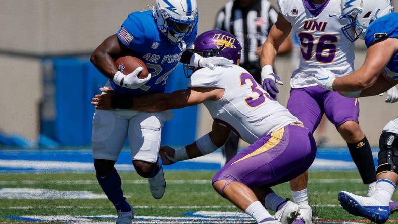 Sep 3, 2022; Colorado Springs, Colorado, USA; Air Force Falcons running back John Lee Eldridge III (24) runs through the tackle of Northern Iowa Panthers linebacker Cameron Baker (39) in the third quarter at Falcon Stadium. Mandatory Credit: Isaiah J. Downing-USA TODAY Sports