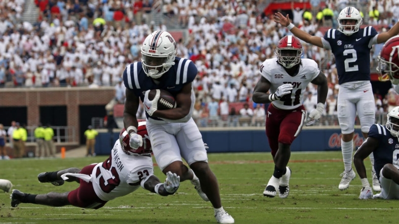 Sep 3, 2022; Oxford, Mississippi, USA; Mississippi Rebels running back Quinshon Judkins (4) runs the ball during the first half against the Troy Trojans at Vaught-Hemingway Stadium. Mandatory Credit: Petre Thomas-USA TODAY Sports