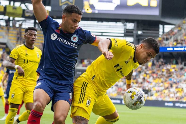 Sep 3, 2022; Columbus, Ohio, USA; Columbus Crew forward Cucho (9) dribbles the ball while Chicago Fire defender Miguel Angel Navarro (6) defends in the first half at Lower.com Field. Mandatory Credit: Trevor Ruszkowski-USA TODAY Sports