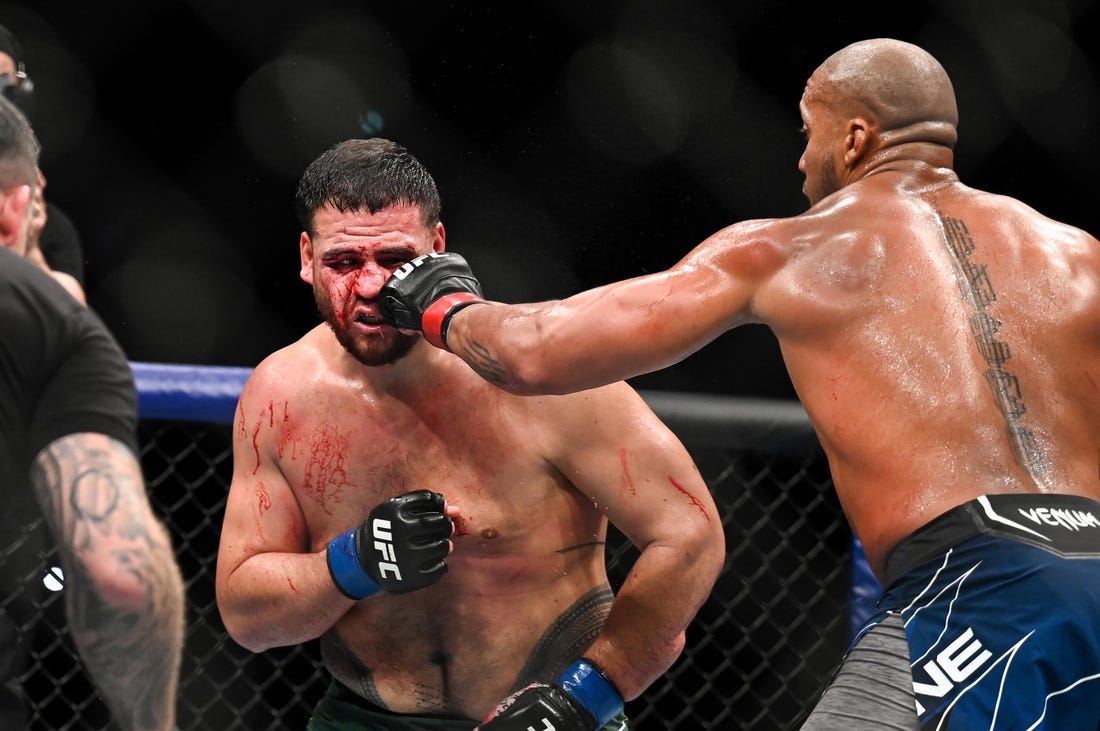 Sep 3, 2022; Paris, FRANCE; Ciryl Gane (red gloves) and Tai Tuivasa (blue gloves) during UFC Fight Night at Accor Arena. Mandatory Credit: Per Haljestam-USA TODAY Sports