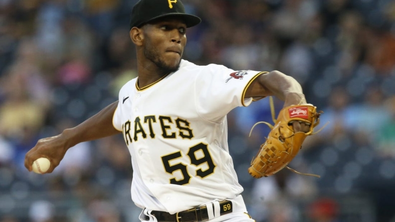 Sep 3, 2022; Pittsburgh, Pennsylvania, USA; Pittsburgh Pirates starting pitcher Roansy Contreras (59) delivers a pitch against the Toronto Blue Jays during the first inning  at PNC Park. Mandatory Credit: Charles LeClaire-USA TODAY Sports