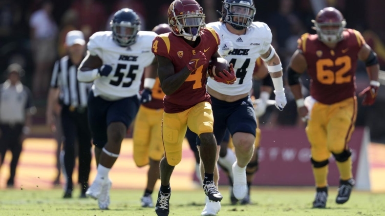 Sep 3, 2022; Los Angeles, California, USA; Southern California Trojans receiver Max Williams (4) carries the ball against the Rice Owls at United Airlines Field at Los Angeles Memorial Coliseum. Mandatory Credit: Kirby Lee-USA TODAY Sports