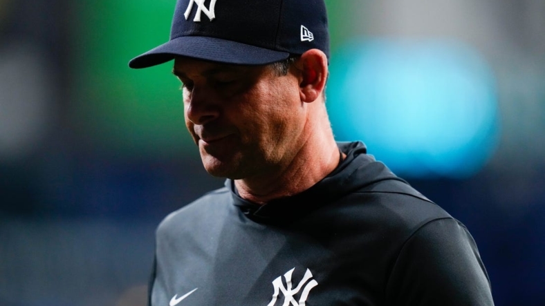 Sep 3, 2022; St. Petersburg, Florida, USA; New York Yankees manager Aaron Boone (17) walks off the field after talking to his players against the Tampa Bay Rays during the fifth inning at Tropicana Field. Mandatory Credit: Rich Storry-USA TODAY Sports