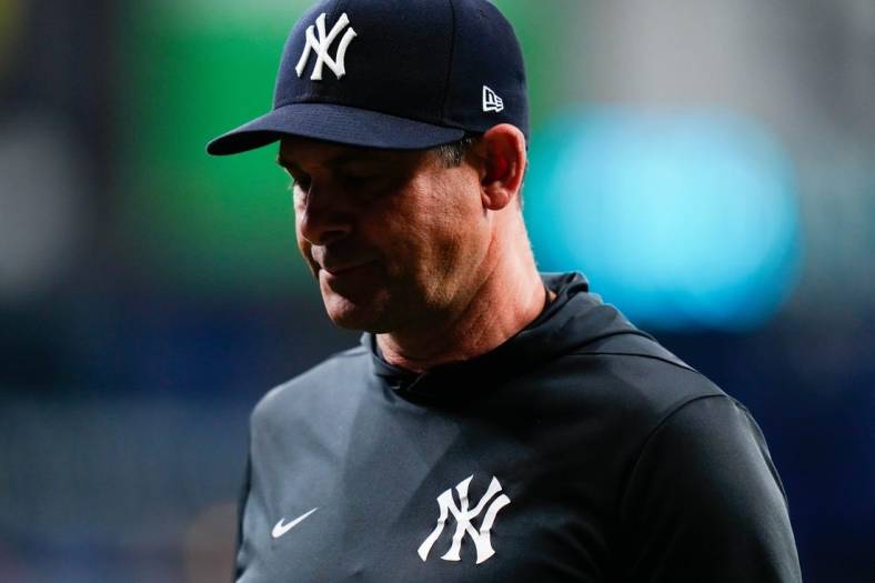 Sep 3, 2022; St. Petersburg, Florida, USA; New York Yankees manager Aaron Boone (17) walks off the field after talking to his players against the Tampa Bay Rays during the fifth inning at Tropicana Field. Mandatory Credit: Rich Storry-USA TODAY Sports