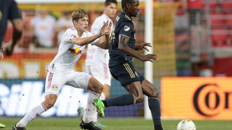 Sep 3, 2022; Harrison, New Jersey, USA; Philadelphia Union defender Nathan Harriel (26) controls the ball against New York Red Bulls midfielder Daniel Edelman (75) during the first half at Red Bull Arena. Mandatory Credit: Vincent Carchietta-USA TODAY Sports