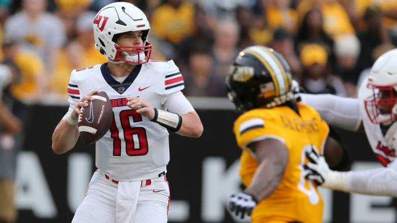 Sep 3, 2022; Hattiesburg, Mississippi, USA; Liberty Flames quarterback Charlie Brewer (16) looks to throw against the Southern Miss Golden Eagles in the first quarter at M.M. Roberts Stadium. Mandatory Credit: Chuck Cook-USA TODAY Sports